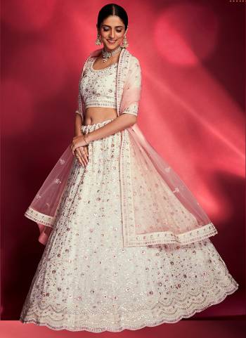 For A Designer Look,Grab These Lehenga Choli in Fine Colored.These Lehenga And Blouse Are Fabricated On Georgette Pair With Soft Net Dupatta.Its Beautified With Thread,Sequance Embroidery,Swarovski Work.