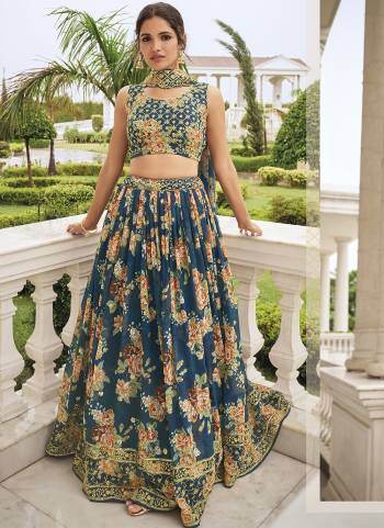 Garb This Partywear Fine Color Heavy Designer Lehemga Choli Fabric Are Faux Georgette And And Dupatta Faux Georgette In Fabricated Beautified With Attrective Floral Digital Printed,Thread,Sequance Embroidery Work. Buy Now.