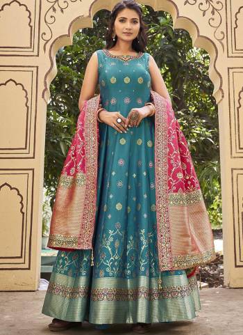 For A Designer Look,Grab These Readymade Gown With Dupatta in Fine Colored.These Gown Are Fabricated JEQARD With SILK JEQARD Dupatta.Its Beautified With Wevon Jacquard Butti,Kalamkari Printed With Embroidery Work.