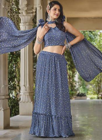 For A Designer Look,Grab These Lehenga Choli in Fine Colored.These Lehenga And Blouse Are Fabricated On Georgette Pair With Georgette Dupatta.Its Beautified With Designer Metalic Foil Printed With Crush Pattern.