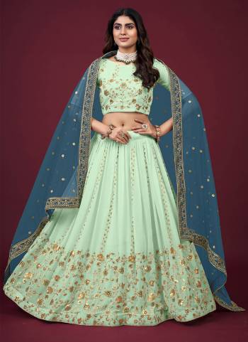 For A Designer Look,Grab These Lehenga Choli in Fine Colored.These Lehenga And Blouse Are Fabricated On Faux Georgette Pair With Butterfly Net Blouse.Its Beautified With Designer Thread,Jari,Sequance Embroidery Work.