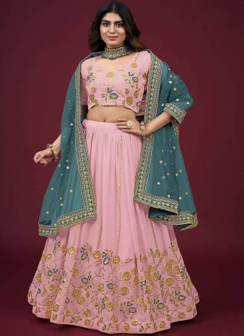 For A Designer Look,Grab These Lehenga Choli in Fine Colored.These Lehenga And Blouse Are Fabricated On Faux Georgette Pair With Butterfly Net Blouse.Its Beautified With Designer Thread,Jari,Sequance Embroidery Work.