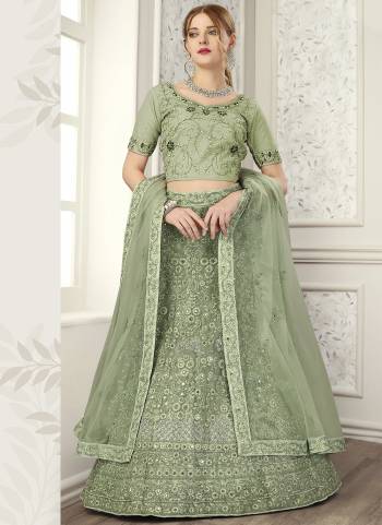 For A Fancy Heavy Designer Look,Grab These Lehenga Choli With Dupatta in Fine Colored.These Lehenga And Choli Are Net And Dupatta Are Fabricated On Soft Net Pair.Its Beautified With Designer Mirror,Jari Embroidery,Zarkan Work.