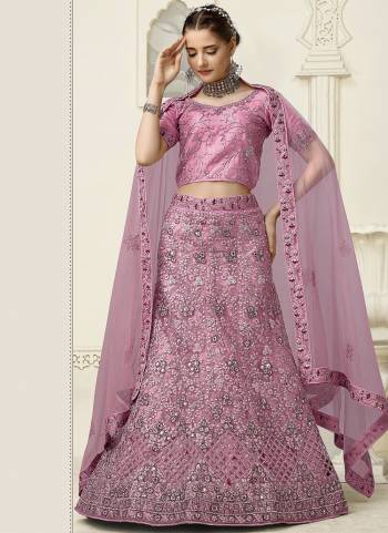 For A Fancy Heavy Designer Look,Grab These Lehenga Choli With Dupatta in Fine Colored.These Lehenga And Choli Are Net And Dupatta Are Fabricated On Soft Net Pair.Its Beautified With Designer Mirror,Jari Embroidery,Zarkan Work.