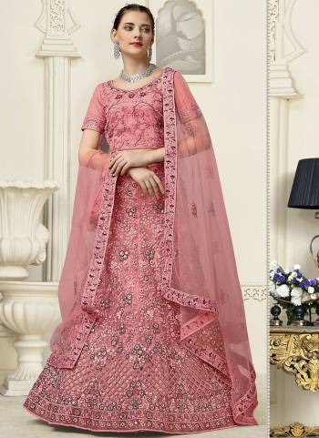 For A Fancy Heavy Designer Look,Grab These Lehenga Choli With Dupatta in Fine Colored.These Lehenga And Choli Are Net And Dupatta Are Fabricated On Soft Net Pair.Its Beautified With Designer Mirror,Jari Embroidery,Zarkan Work.