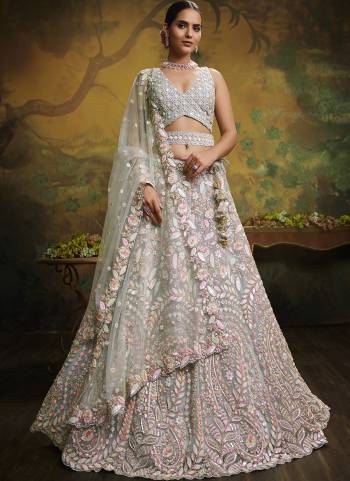 Attrective Looking This Partywear Fine Color Heavy Designer Choli Fabric Are Net And Lahenga Net And Dupatta Net In Fabricated Beautified With Attrective Thread,Sequance Embroidery Work. Buy Now.