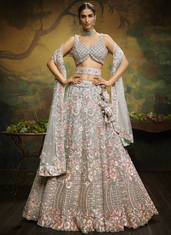 Attrective Looking This Partywear Fine Color Heavy Designer Choli Fabric Are Net And Lahenga Net And Dupatta Net In Fabricated Beautified With Attrective Thread,Sequance Embroidery Work. Buy Now.