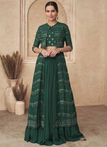 Green colored gharara choli is prettified with sequins embroidered work as shown which makes it appear classy. This gharara is made of georgette fabric which is accompanied with georgette blouse, santoon lining and georgette jacket. Women can buy this gharara choli to wear for their parties, functions and events.