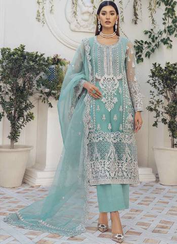 Sky colored pakistani suit is prettified with floral embroidered with moti work as shown which makes it appear classy. This top is made of organza silk fabric which is accompanied with santoon bottom, santoon lining and net work dupatta. Women can buy this suit to wear for their festive, parties, functions and event.