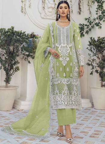 Green colored pakistani suit is prettified with floral embroidered with moti work as shown which makes it appear classy. This top is made of organza silk fabric which is accompanied with santoon bottom, santoon lining and net work dupatta. Women can buy this suit to wear for their festive, parties, functions and event.