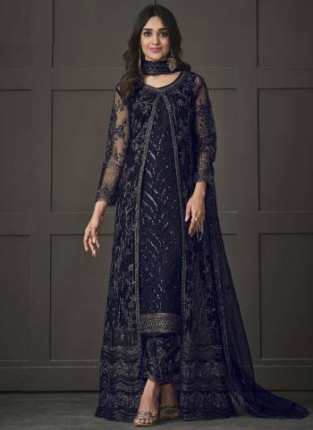 Step out in style adorning this blue colored pakistani straight suit. This butterfly net suit is beautifully adorned with heavy embroidered,floral lace,cording & glitter sequences work comes along with net & japan silk bottom, inner is japan satin and net dupatta makes it appear more adorning. Women can buy this suit to wear for their upcoming festivals, homely functions, parties, kitties, weekend get together. Get this unstitched suit stitched according to your fit and comfort.