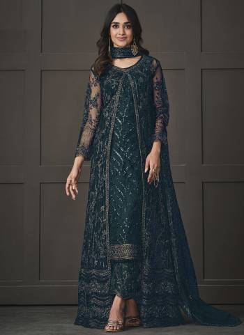 Step out in style adorning this rama colored pakistani straight suit. This butterfly net suit is beautifully adorned with heavy embroidered,floral lace,cording & glitter sequences work comes along with net & japan silk bottom, inner is japan satin and net dupatta makes it appear more adorning. Women can buy this suit to wear for their upcoming festivals, homely functions, parties, kitties, weekend get together. Get this unstitched suit stitched according to your fit and comfort.