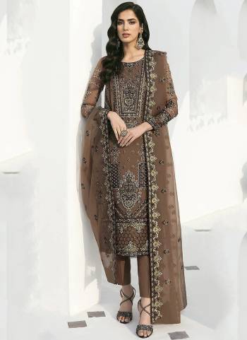 Brown colored suit is prettified with floral embroidered with sequins work as shown which makes it appear classy. This top is made of georgette fabric which is accompanied with santoon bottom, santoon lining and georgette dupatta. Women can buy this suit to wear for their parties and functions.