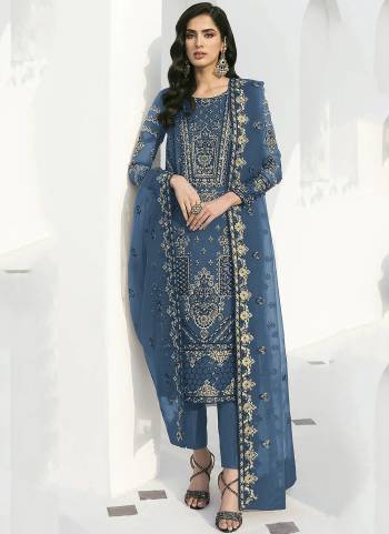 Blue colored suit is prettified with floral embroidered with sequins work as shown which makes it appear classy. This top is made of georgette fabric which is accompanied with santoon bottom, santoon lining and georgette dupatta. Women can buy this suit to wear for their parties and functions.