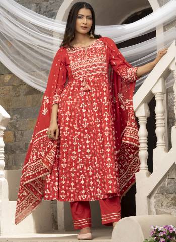 Kurta : Red Cotton Cambric Printed with Sequins work Anarkali Kurta, has a Round Neck , three-quarter regular sleeves with Gota patti lace, 
Bottom : Red Cotton Pant With lace Work 
Dupatta : Red Cotton Malmal Printed dupatta.