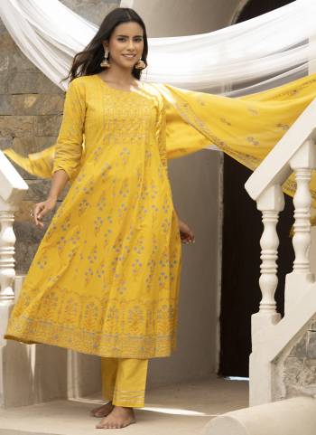 Kurta : Mustard Cotton Cambric Printed with Sequins work Anarkali Kurta, has a Round Neck , three-quarter regular sleeves,
Bottom : Mustard Cotton Pant With lace Work 
Dupatta : Mustard Cotton Malmal Printed dupatta.