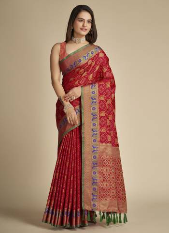 Garb This Partywear Saree Paired With Blouse In Fine Color.This Saree And Blouse Are Patola Silk Based Fabric With Weaving Jacquard Designer. Buy This Pretty Saree Now.