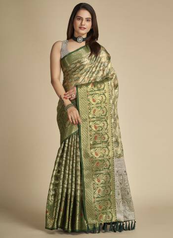 Garb This Partywear Saree Paired With Blouse In Fine Color.This Saree And Blouse Are Tissue Silk Based Fabric With Weaving Jacquard Designer. Buy This Pretty Saree Now.