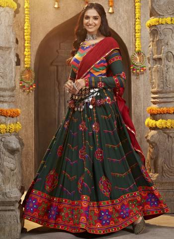 Grab These Navratri Special Lehenga Choli in Fine Colored.These Lehenga And Blouse Are Viscose Rayon And Dupatta Are Fabricated On Cotton.Its Beautified With Crushed,Heavy Mirror,Thread Embroidery Work.