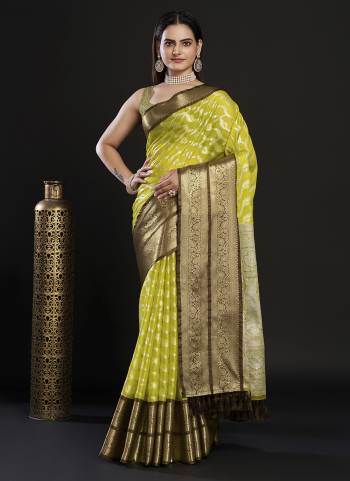 Garb This Partywear Saree Paired With Blouse In Fine Color.This Saree And Blouse Are Kanjivaram Silk Based Fabric With Weaving Jacquard Designer. Buy This Pretty Saree Now.