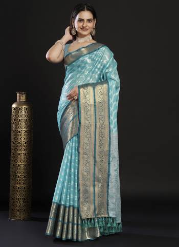 Garb This Partywear Saree Paired With Blouse In Fine Color.This Saree And Blouse Are Kanjivaram Silk Based Fabric With Weaving Jacquard Designer. Buy This Pretty Saree Now.