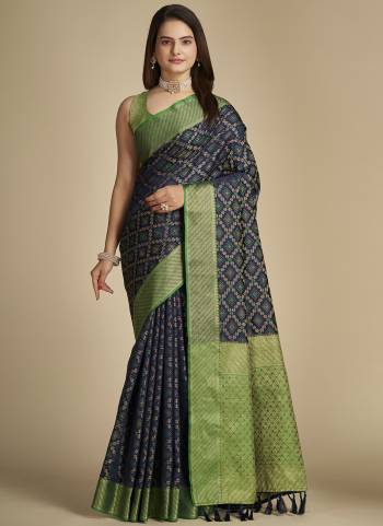 Garb This Partywear Saree Paired With Blouse In Fine Color.This Saree And Blouse Are Patola Silk Based Fabric With Weaving Banarasi Designer. Buy This Pretty Saree Now.