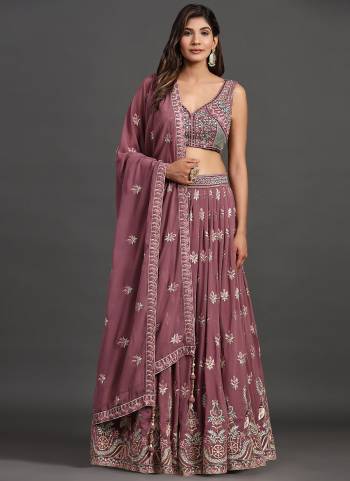 For A Designer Look,Grab These Lehenga Choli in Fine Colored.These Lehenga And Blouse Are Fabricated On Georgette Pair With Georgette Dupatta.Its Beautified With Designer Sequance,Thread,Mirror Embroidery Work.