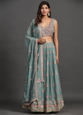 For A Designer Look,Grab These Lehenga Choli in Fine Colored.These Lehenga And Blouse Are Fabricated On Georgette Pair With Georgette Dupatta.Its Beautified With Designer Sequance,Thread,Mirror Embroidery Work.