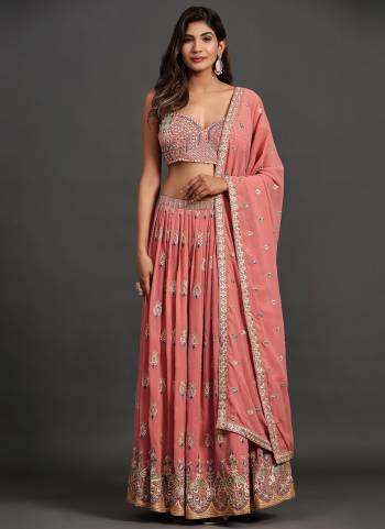 For A Designer Look,Grab These Lehenga Choli in Fine Colored.These Lehenga And Blouse Are Fabricated On Georgette Pair With Georgette Dupatta.Its Beautified With Designer Sequance,Thread,Mirror Embroidery Work.