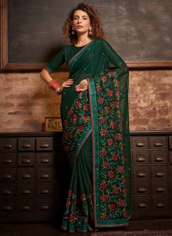 Garb These Designer Saree in Fine Colored.These Saree Are Gold Coin Chiffon And Blouse is Fabricated On Gold Coin Chiffon Pair.Its Beautified Blooming Color,Panel Embroidery,Swarovski Work.