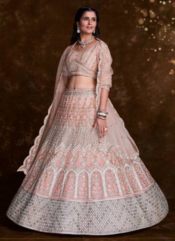 For A Designer Look,Grab These Lehenga Choli in Fine Colored.These Lehenga And Choli Are Fabricated On Net Pair With Soft Net Dupatta.Its Beautified With Heavy Designer Embroidery,Zarkan Work.