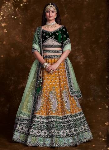 For A Designer Look,Grab These Lehenga Choli in Fine Colored.These Lehenga Are Art Silk And Choli Are Fabricated On Velvet Pair With Soft Net Dupatta.Its Beautified With Heavy Designer Embroidery,Zarkan Work.