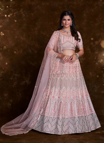 For A Designer Look,Grab These Lehenga Choli in Fine Colored.These Lehenga And Choli Are Fabricated On Net Pair With Soft Net Dupatta.Its Beautified With Heavy Designer Embroidery,Zarkan Work.