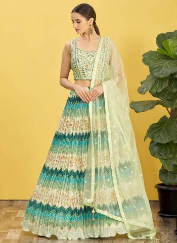 For A Designer Look,Grab These Lehenga Choli in Fine Colored.These Lehenga Are Chinon And Blouse Are Fabricated On Slub Silk Pair With Organza Soft Net.Its Beautified With Designer Printed With Real Mirror,Thread,Jari,Sequance Embroidery Work.