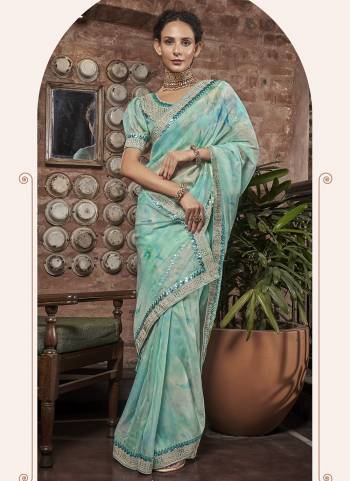 Garb These Designer Party Wear Saree in Fine Colored.These Saree Are Organza And Blouse is Fabricated On Art Silk Pair.Its Beautified Digital Printed,Embroidery Work Blouse,Border.