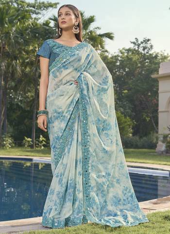 Garb These Designer Party Wear Saree in Fine Colored.These Saree Are Organza And Blouse is Fabricated On Art Silk Pair.Its Beautified Digital Printed,Khatli Work Blouse,Border.