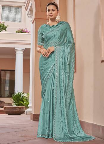 Garb These Designer Party Wear Saree in Fine Colored.These Saree Are Satin Chiffon And Blouse is Fabricated On Satin Chiffon Pair.Its Beautified Blooming Color With Swarovski Work Blouse,Border.