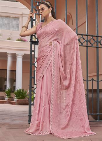 Garb These Designer Party Wear Saree in Fine Colored.These Saree Are Satin Chiffon And Blouse is Fabricated On Satin Chiffon Pair.Its Beautified Blooming Color With Swarovski Work Blouse,Border.