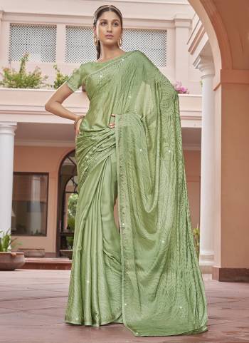 Garb These Designer Party Wear Saree in Fine Colored.These Saree Are Satin Chiffon And Blouse is Fabricated On Satin Chiffon Pair.Its Beautified Blooming Color With Swarovski Work Blouse,Border.