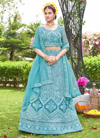 Grab These Beautiful Colored Lehenga Choli.These Lehenga and Dupatta Are Fabricated On Net Pair With Net Blouse.Its Beautified With Heavy Thread,Sequance Embroidery Work.