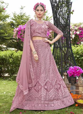 Grab These Beautiful Colored Lehenga Choli.These Lehenga and Dupatta Are Fabricated On Net Pair With Net Blouse.Its Beautified With Heavy Thread,Sequance Embroidery Work.