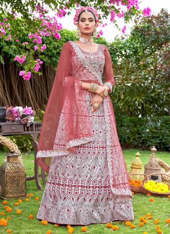 Grab These Beautiful Colored Lehenga Choli.These Lehenga and Dupatta Are Fabricated On Net Pair With Net Blouse.Its Beautified With Heavy Embroidery Work.