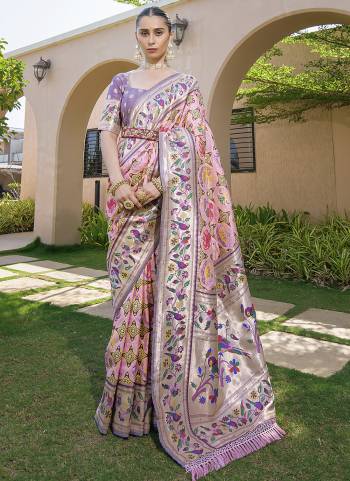 Garb These Festive Wear Saree in Fine Colored.These Saree And Blouse is Fabricated On Paithani Silk.Its Beautified With Paithani Weavon Meenakari,Jari Designer.