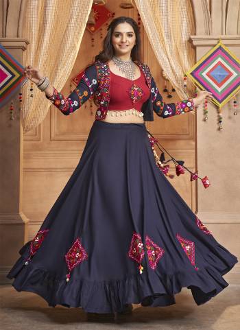 Attrective These Navratri Special Lehenga Choli With Koti in Fine Colored.These Lehenga And Blouse Are Viscose Rayon And Koti Are Fabricated On Viscose Rayon.Its Beautified With Heavy Mirror,Thread Embroidery Work.