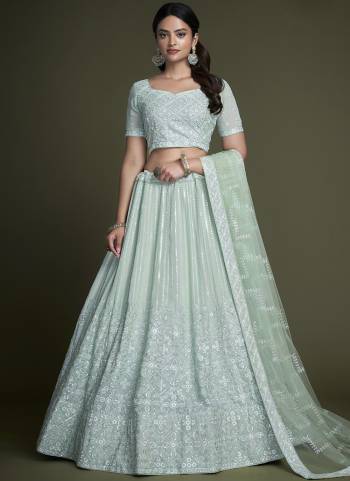 For A Designer Look,Grab These Lehenga Choli in Fine Colored.These Lehenga And Choli Are Fabricated On Georgette Pair With Soft Net Dupatta.Its Beautified With Heavy Designer Sequance,Thread Embroidery Work.