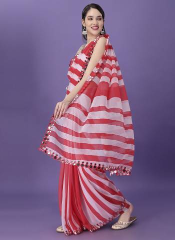 Garb These Party Wear Saree in Fine Colored.These Saree Are Georgette And Blouse is Jari Brocade Fabricated.Its Beautified With Lahriya Designer Printed,Mirror Lace Border.