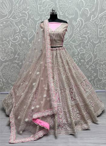 For A Fancy Designer Look,Grab These Lehenga Choli With Dupatta in Fine Colored.These Lehenga And Choli Are Net And Dupatta Are Fabricated On Soft Net Pair.Its Beautified With Dori,Jari,Sequance Embroidery,Diamond Work.