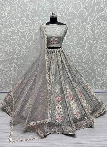 For A Fancy Designer Look,Grab These Lehenga Choli With Dupatta in Fine Colored.These Lehenga Are Net And Choli Are Organza And Dupatta Are Fabricated On Soft Net Pair.Its Beautified With Thread,Sequance Embroidery,Diamond Work.