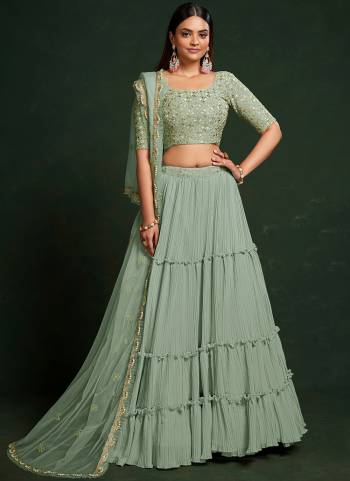 For A Designer Look,Grab These Lehenga Choli in Fine Colored.These Lehenga Are Faux Georgette And Dupatta Are Fabricated On Net Pair With Faux Georgette Blouse.Its Beautified With Thread,Sequance Embroidery Work.