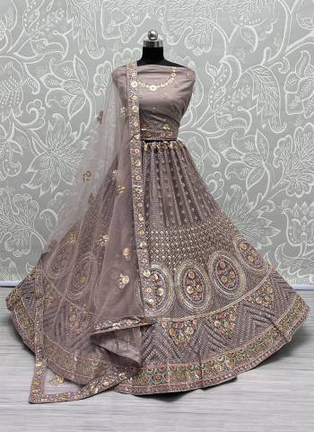 For A Fancy Designer Look,Grab These Lehenga Choli With Dupatta in Fine Colored.These Lehenga And Choli Are Net And Dupatta Are Fabricated On Soft Silk Pair.Its Beautified With Designer Thread,Sequance,Dori Embroidery,Zarkan Diamond Work.